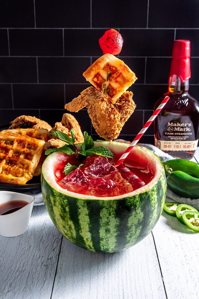 red drink in a hollowed out watermelon