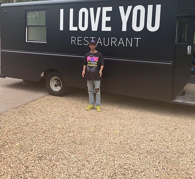 Jaden Smith in front of his "I Love You" Restaurant
