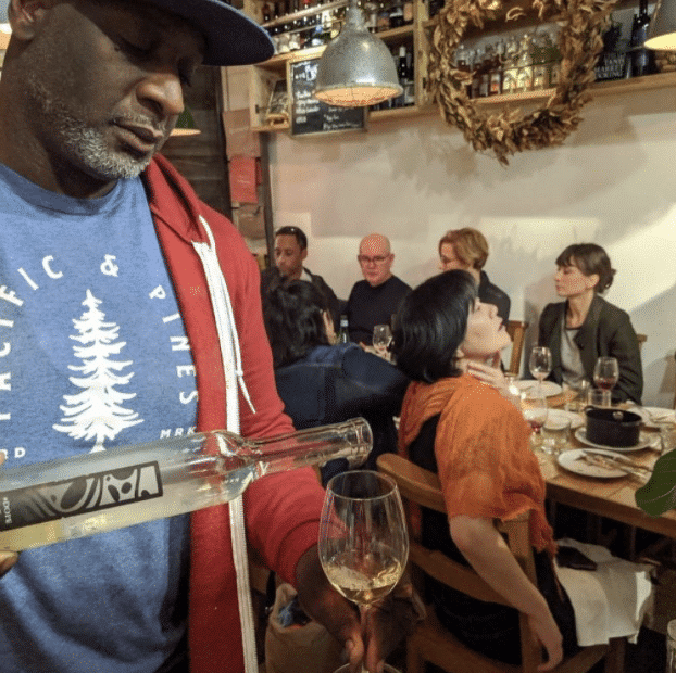 A man pouring wine at the Crick PDX