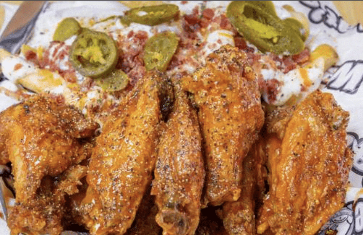 Chicken wings and loaded fries from We Dat's, a black owned franchise