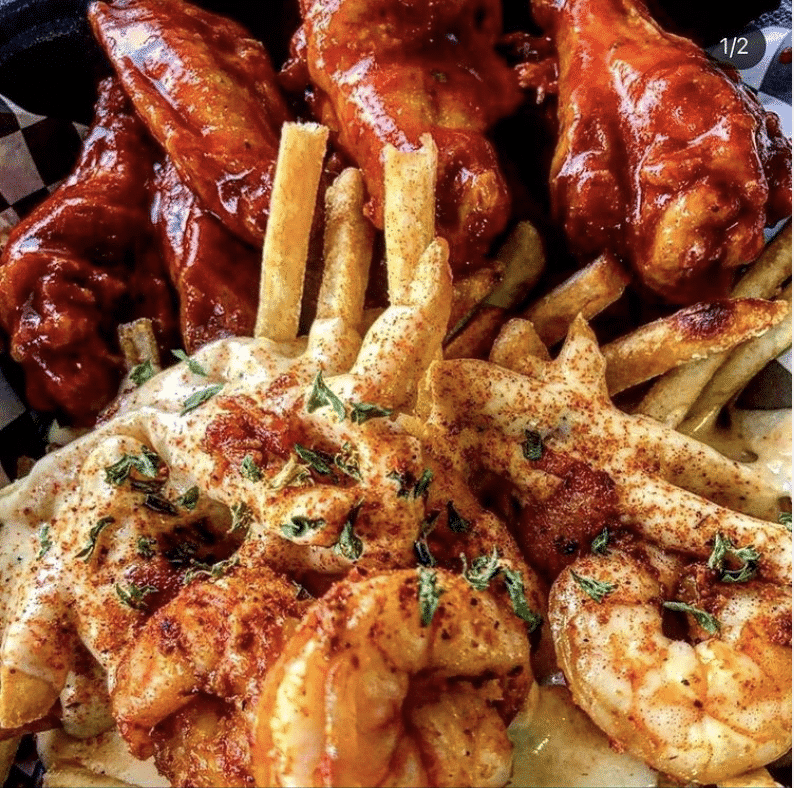 Chicken wings, fries, and shrimp from the new Encore Rouge restaurant