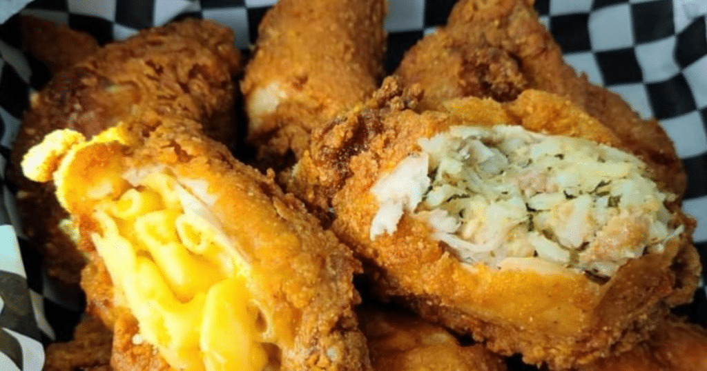 Close up of Stuff'd Wings' signature fried chicken wings with sides like macaroni and cheese stuffed inside. This is one of the best new restaurants in Houston. This is also a Black-owned restaurant in Houston in 2022.